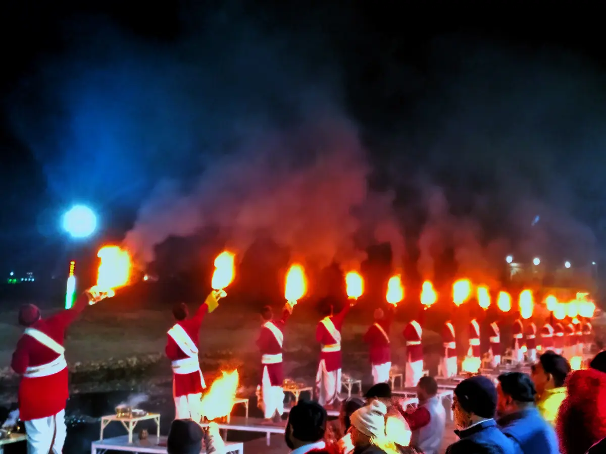 Evening Ganga aarti with fire lamps at Triveni Ghat, Rishikesh